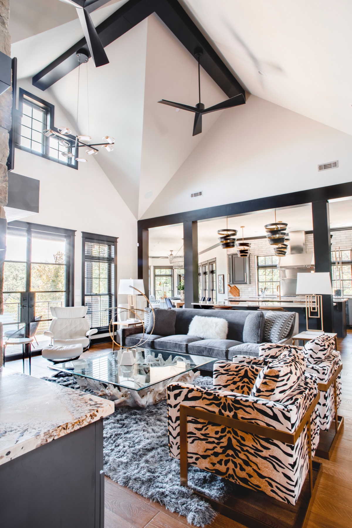 Vaulted great room with designer furnishings and open kitchen